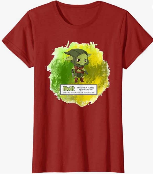 Red t-shirt featuring a cartoon goblin character with green skin, wearing a green outfit, surrounded by a colorful splash background. The shirt includes the text 'Molit The Goblin Fueled by Moscovium' and atomic information.